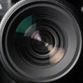 Close-up of a camera lens displaying concentric rings of the lens elements. The oute Royalty Free Stock Photo