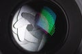 Close-up of a camera mirror lens front lens with aperture and highlights from a light source Royalty Free Stock Photo