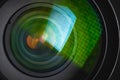 Close-up of a camera mirror lens front lens with aperture and highlights from a light source Royalty Free Stock Photo