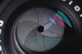Close-up of a camera mirror lens front lens with aperture and highlights from a light source Royalty Free Stock Photo