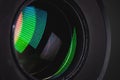 Close-up of a camera mirror lens front lens with aperture and highlights from a light source Royalty Free Stock Photo