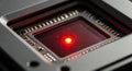 A close-up of a camera sensor chip with a red LED light at its center Royalty Free Stock Photo