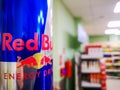 close-up of a can of energy drink with caffeine and taurine Red Bull in a grocery store against the background of a