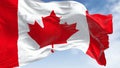 Close-up of Canada national flag waving in the wind on a clear day Royalty Free Stock Photo