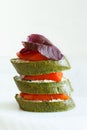 Close-up of canapes with salmon, basil and spinach bread