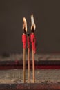 Close up candle incense with fire in the old chinese temple. Royalty Free Stock Photo