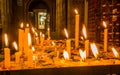 Close up of candles over a metallic structure inside of Santo Domingo Church in Quito, Ecuador Royalty Free Stock Photo