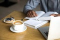 Close up of cappuccino cup served to black cafe visitor