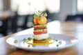 close-up of caprese salad stack with a mozzarella ball top