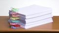 Stack of white paper sheets on a wooden surface Royalty Free Stock Photo