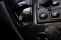 .Close up of the car cigarette lighter socket.modern car interior: parts, buttons, knobs Royalty Free Stock Photo