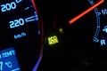 Close up of car dashboard with green hybrid mode icon on. Royalty Free Stock Photo
