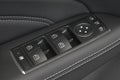 Close up of a car door control panel buttons