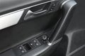 Close up of a car door handle and control pannel