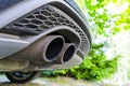 Close up of a car dual exhaust pipe. Double exhaust pipes of a modern sports car. Car exterior details. Car detailing. Royalty Free Stock Photo