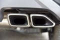 Close up of a car dual exhaust pipe