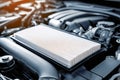 Close-up of a car engine bay featuring a new high-performance air filter installed for enhanced airflow and engine efficiency, Royalty Free Stock Photo