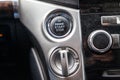 Close-up car engine ignition start and stop button on the dashboard, electric key, modern gray design with chrome elements on the Royalty Free Stock Photo