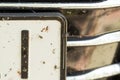 Close-up of car front bumper with many smashed insects. High speed drive Royalty Free Stock Photo