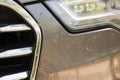 Close-up of car front bumper with many smashed insects. High speed drive Royalty Free Stock Photo
