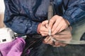 Close up Car glaze worker fixing and repairing a windshield or windshield of a car at a garage service station. Drill Royalty Free Stock Photo