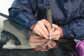 Close up Car glaze worker fixing and repairing a windshield or windshield of a car at a garage service station. Drill Royalty Free Stock Photo