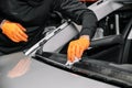 Close up, Car glazing, fixing and repairing a windshield. Windscreen replace process of a car at a garage service