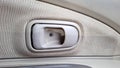 Close-Up of Car Interior Door Handle on Fabric Panel Royalty Free Stock Photo