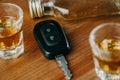 Close up of a car keys and very strong alcohol rum on the table, do not drink and drive concept, driving a car Royalty Free Stock Photo