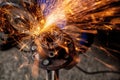 A close-up of a car mechanic using a metal grinder Royalty Free Stock Photo