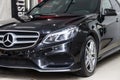 Close-up on a car Mercedes E-class body standing inthe garage box for polishing and removing scratches from the surface. Auto