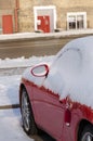 Close up of car side covered with snow in parking Royalty Free Stock Photo