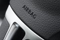 Close up of a car steering wheel airbag Royalty Free Stock Photo