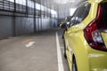 Close up car tail light red color on service blurry background yellow car on street For automotive automobile or transport Royalty Free Stock Photo