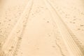 Close up on car tire trace on sand Royalty Free Stock Photo