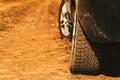 Close up of car tires on dirt country road Royalty Free Stock Photo