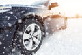 Close up of car tires on the winter road Royalty Free Stock Photo