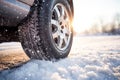 Close up of car tires in winter on the road with snow Royalty Free Stock Photo