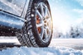 Close up of car tires in winter on the road with snow