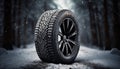 Close up of car tires in winter on snowy road covered with snowWinter tire traction concept. Royalty Free Stock Photo