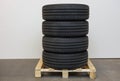 Close up car tyres on wheels storage on a pallet. Car repair box.
