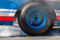 Close up car wheel with smoke on the asphalt road speed track, Car wheel drifting and smoking on track, Car wheel spinning Royalty Free Stock Photo