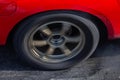 Close up car wheel with smoke on the asphalt road speed track, Car wheel drifting and smoking on track, Car wheel spinning Royalty Free Stock Photo