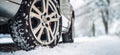 Close-up of car wheel in the snow. Driving in winter ai generated