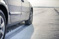 Close-up of car wheels rubber tire in deep snow. Transportation and safety concept Royalty Free Stock Photo