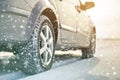 Close-up of car wheels rubber tires in deep winter snow. Transportation and safety concept Royalty Free Stock Photo