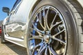 Close up of a car& x27;s rim, wheel with no emblem chrome rims and bl Royalty Free Stock Photo