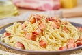 Close up carbonara pasta. Spaghetti with bacon, egg, parmesan cheese and cream sauce. Side view. Traditional italian cuisine Royalty Free Stock Photo