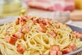 Close up carbonara pasta. Spaghetti with bacon, egg, parmesan cheese and cream sauce. Side view. Traditional italian cuisine Royalty Free Stock Photo