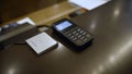 Close-up of a card payment terminal at a hotel counter. Terminal for paying for a hotel room. Hand terminal on the Royalty Free Stock Photo